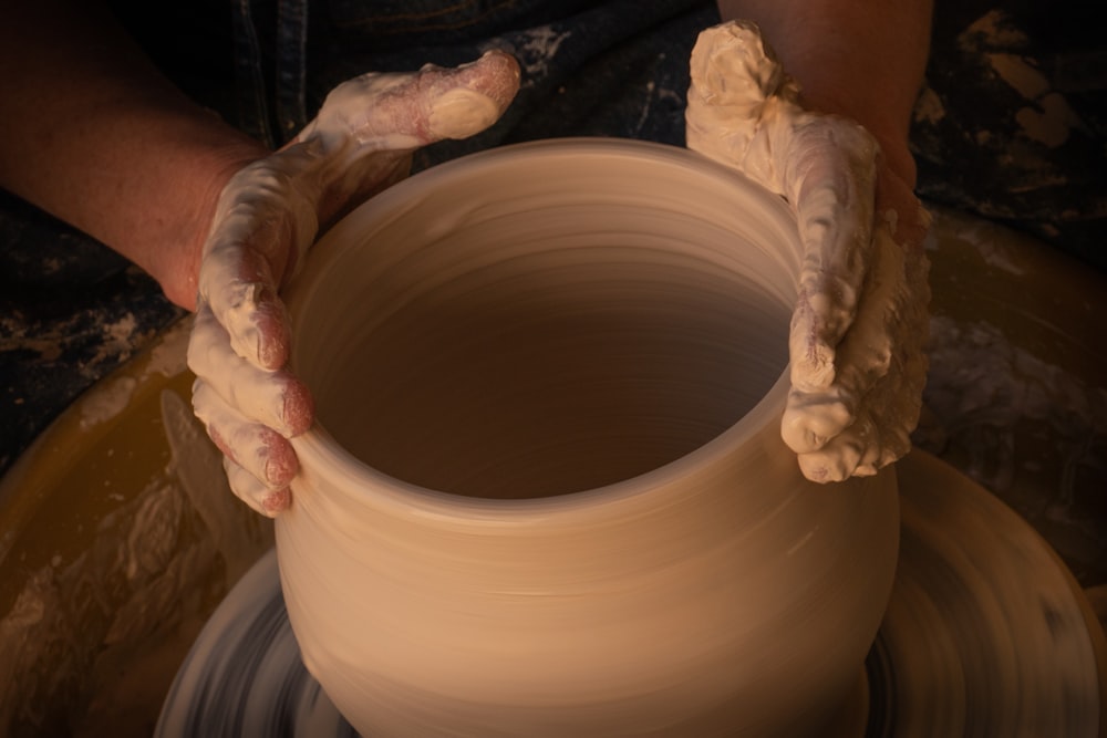 A finished pot held in both hands